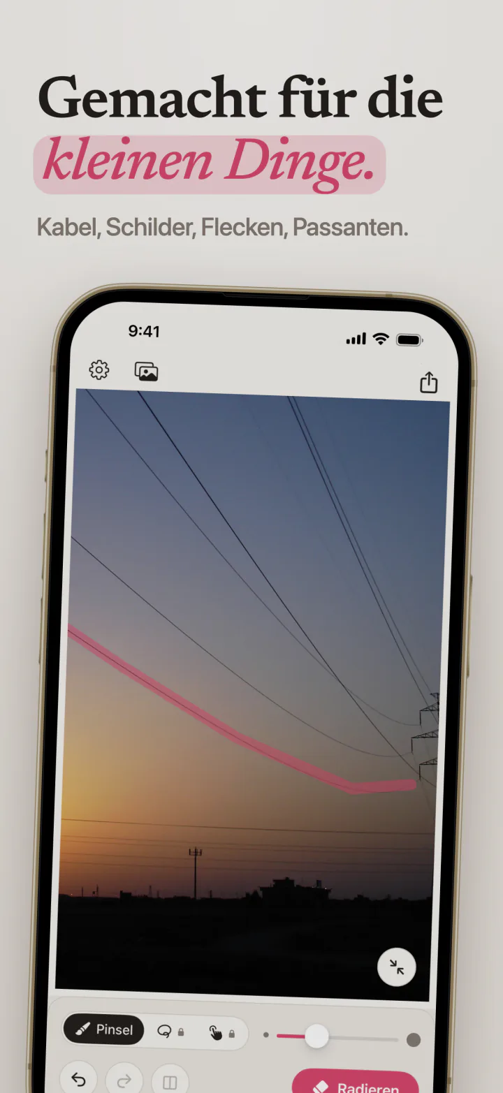 Mend auf dem iPhone mit einem pinken Strich entlang einer Stromleitung vor dem Abendhimmel