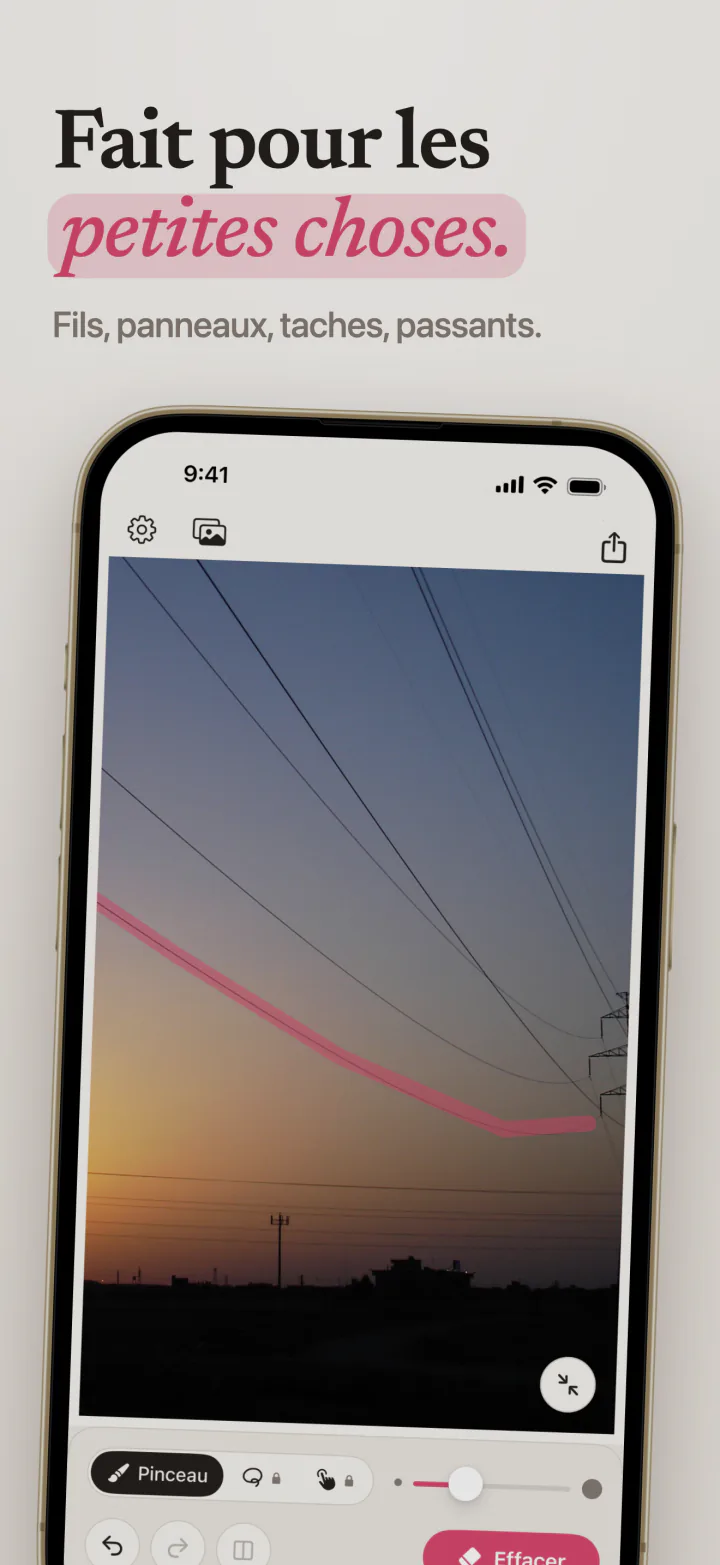 Mend sur iPhone avec un trait rose le long d’une ligne électrique qui traverse le ciel du soir