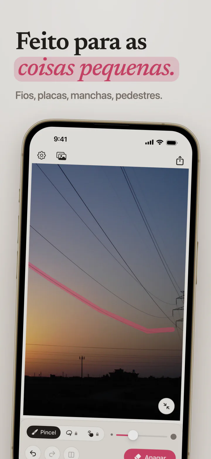 O Mend no iPhone com um traço rosa ao longo de um fio de energia que cruza o céu do entardecer