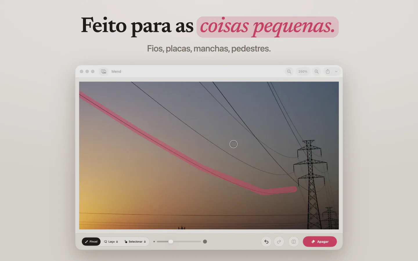 O Mend no Mac com um traço rosa ao longo de um fio de energia que cruza o céu do entardecer